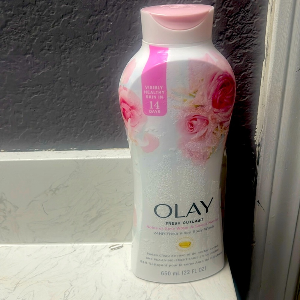 It’s pink a big bottle it will last u for a month and a half